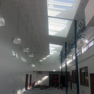 Gyproc Casoline MF suspended ceiling with an acoustic plasterboard finish.